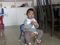 Baby eating watermelon