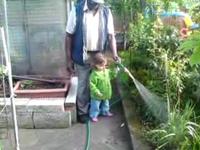 Evie and "Dada" watering the garden
