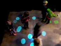 Children playing Personzilla in the Interactive Floor