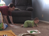 Baby getting chased by dad