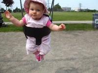 Flora's first time on the swing at the park