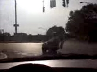 Man in Wheelchair Crosses Street