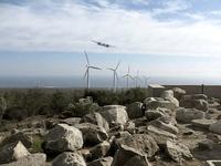 Plane falling on a wind farm