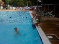 Kids doing "flips" into the pool