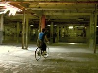 Riding bikes around an old abandoned warehouse in Ypsi