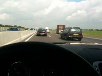 Enjoying myself on the freeway the sun, my car and some really bad music!