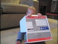 Eli Opening 1st Birthday Gift from Chris