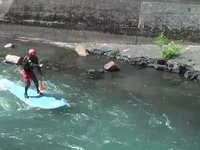 Stand Up Paddling over a small waterfall