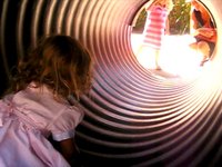 A girl named Saniya who slowly crawls down a tube...