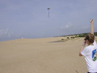 kate flying her first kite.