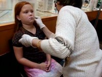 L'il Red gets her ears pierced