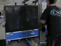 Gizmodo's Installing the 103-inch TV at Gizmodo Gallery to Yakety Sax