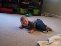 Luke rolling and scooting on the floor