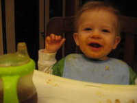 Charley 9 months- giggling at table