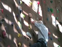 Whitman alum Ryan Crocker scales the rock climbing wall