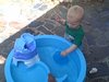 Lincoln Playing with the Water Table