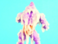 He-Man, posing as Skeletor, wearing a bag on his head, gets engulfed by the holy spirit